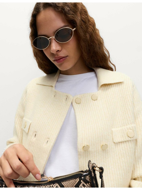 Marks & Spencer Pleteni prsluk s puhastim vlaknima i ukrasnim džepovima Marks & Spencer krem